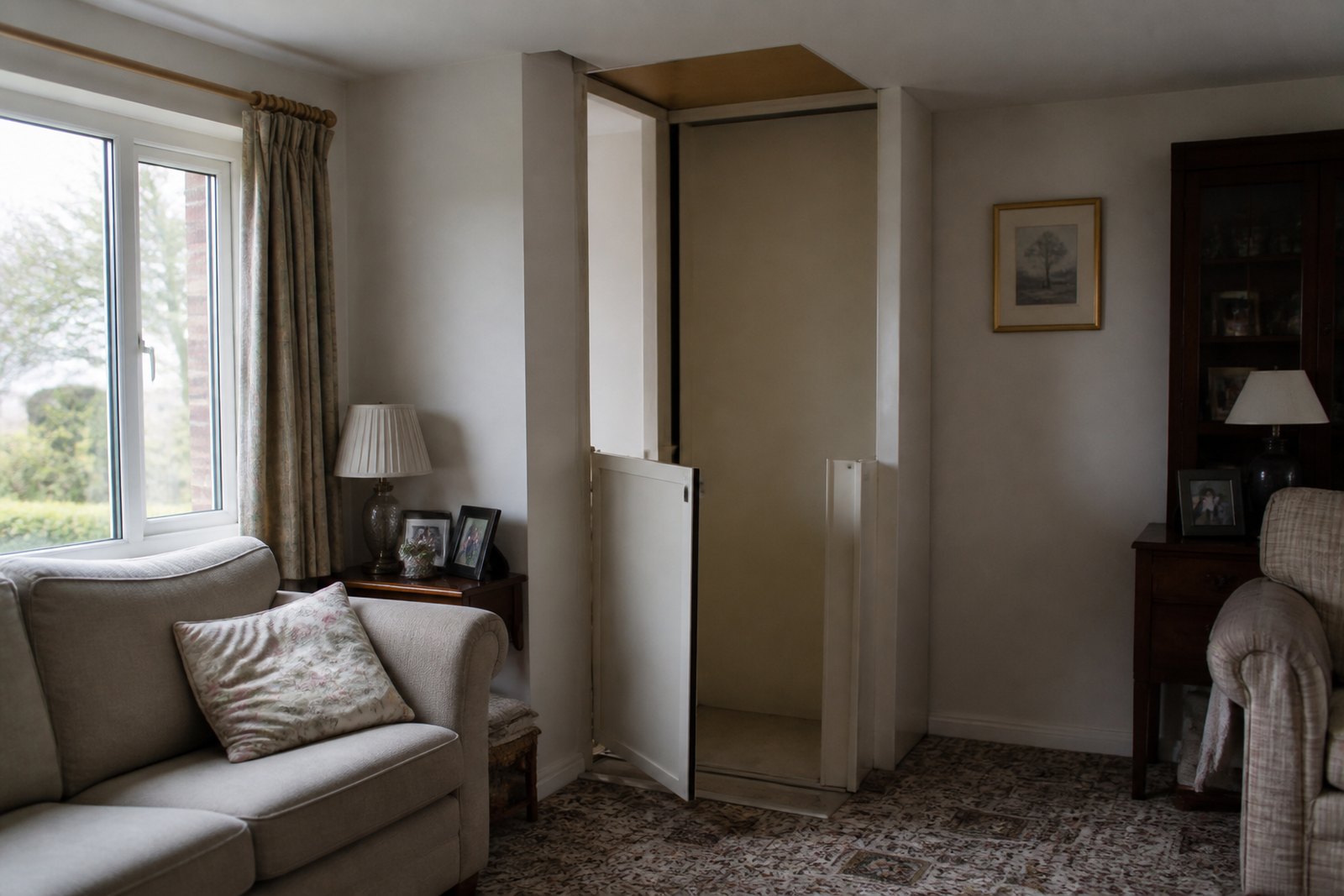 A domestic through-floor lift installed in the corner of an ordinary living room