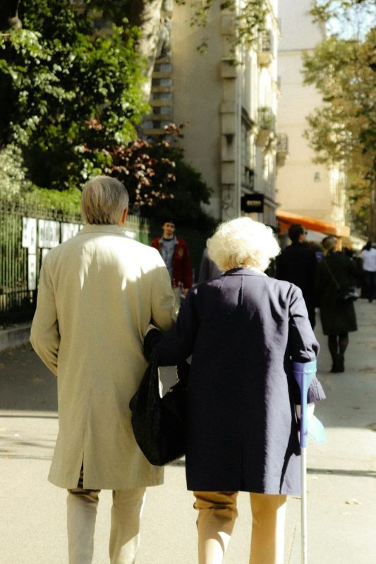 Two people walking together outdoors