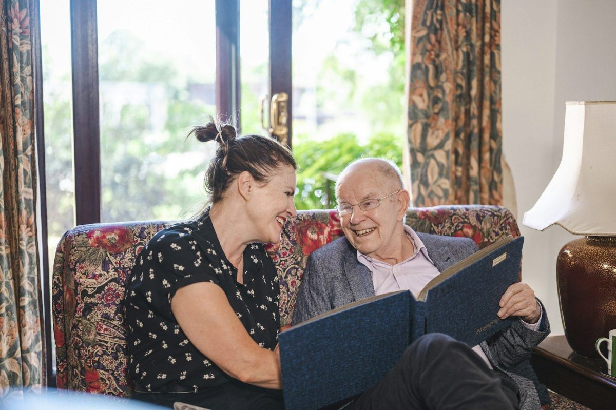 Occupational therapist and client during a home consultation on the sofa