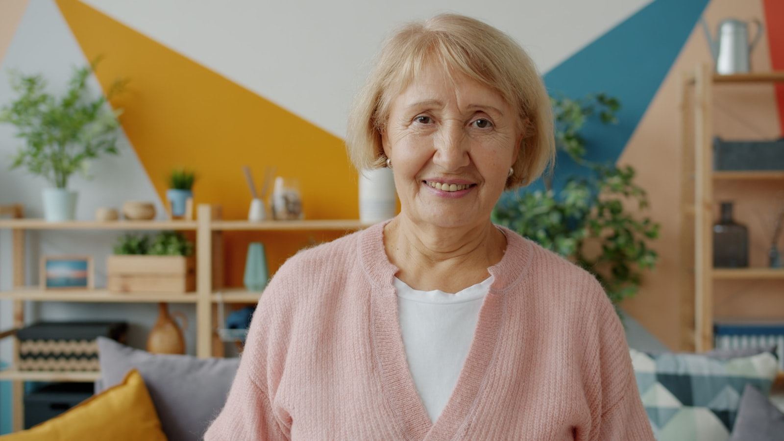 Older woman smiling in her living room