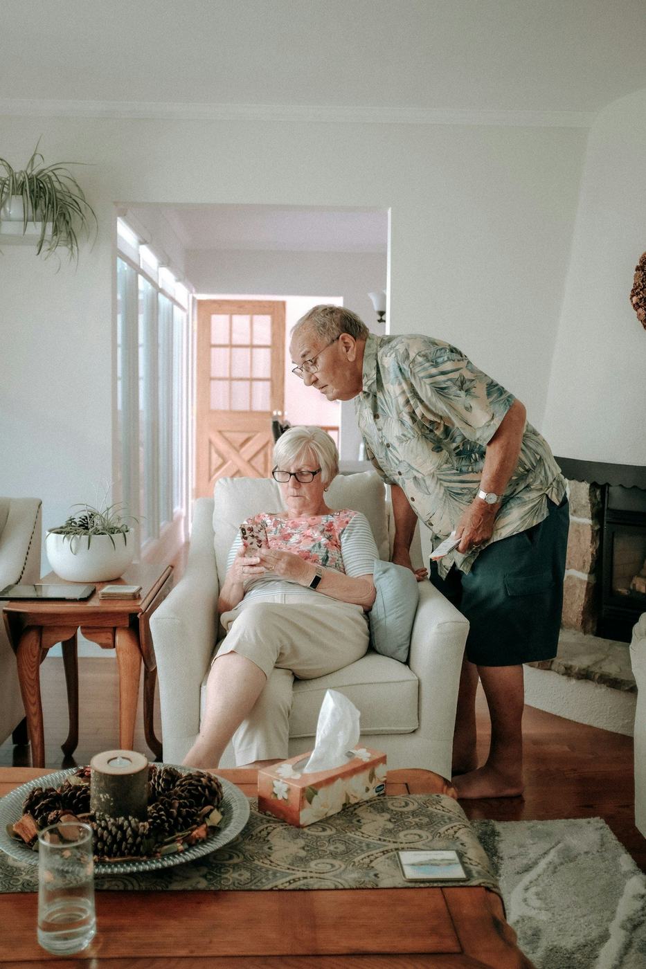 Occupational therapist visiting a client in his living room