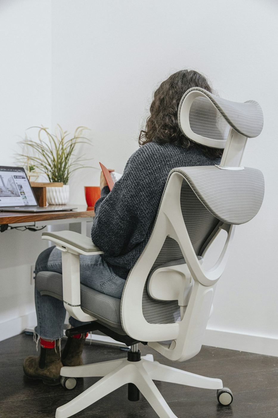 Woman working at an office desk workstation